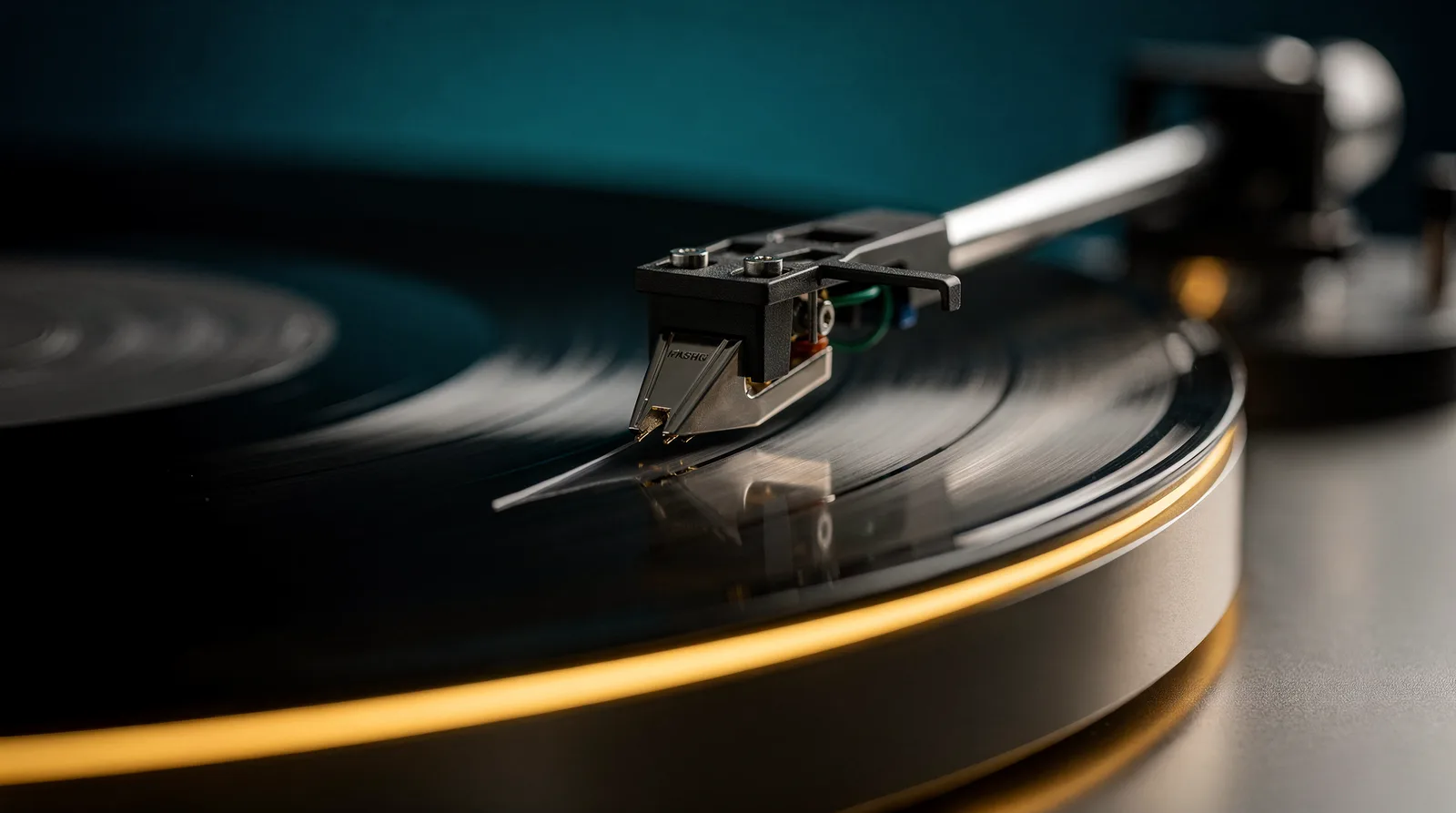 A stylus lowering onto a record under a lamp